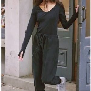 Free People Movement Black Long Sleeve Jumpsuit with thumb holes.